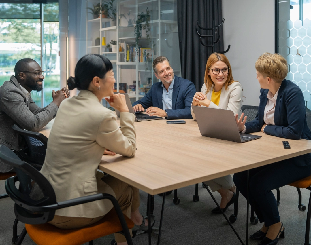 Colleagues discussing in modern office